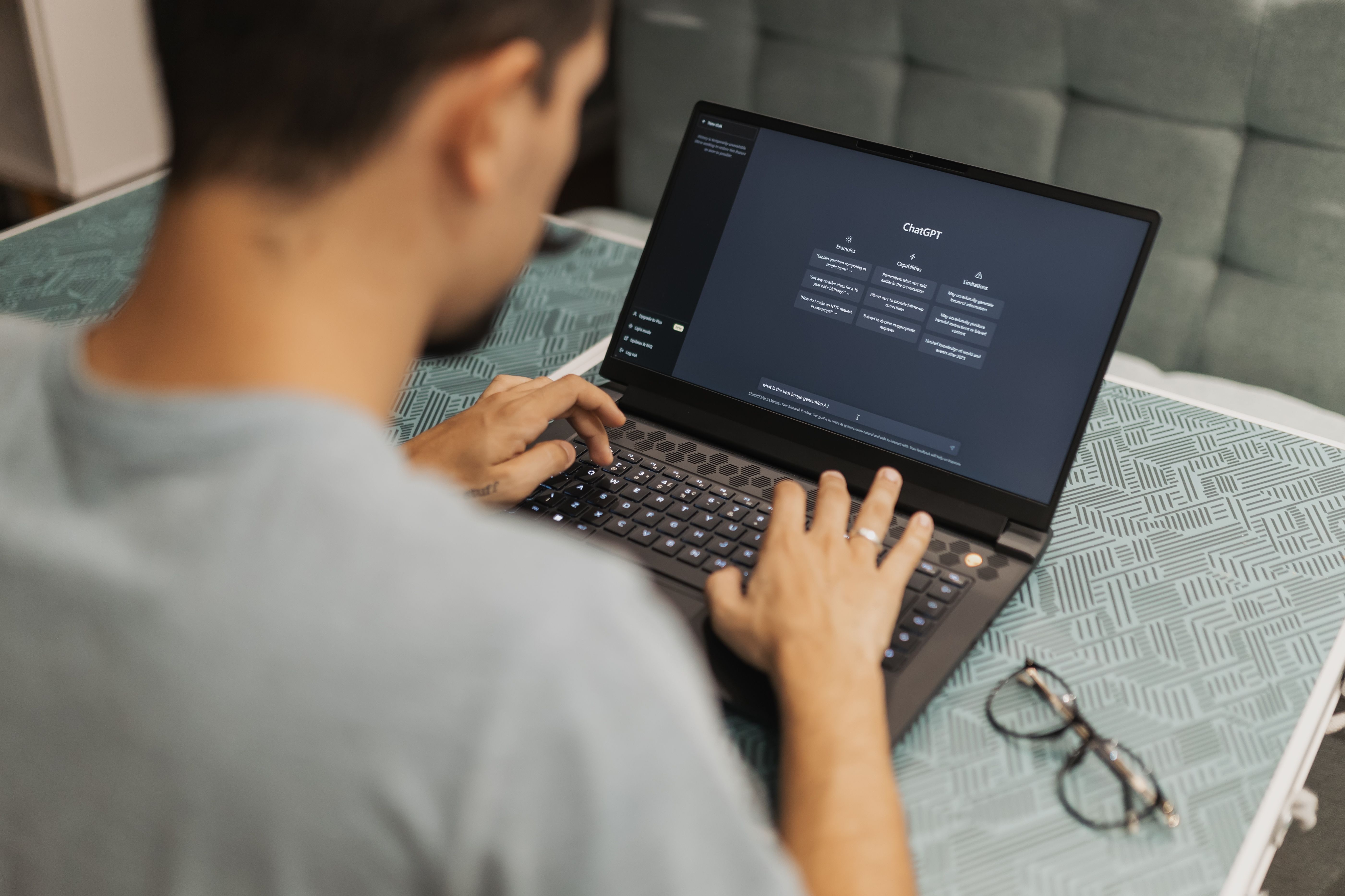 Man using laptop with an AI interface, illustrating AI-generated travel content